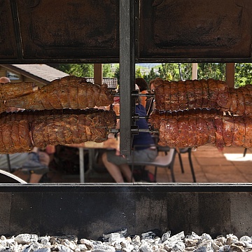 roast pork, lamb gigot and saddle of beef from charcoal grill